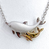 Playful Mother and Baby Dolphin Pendant