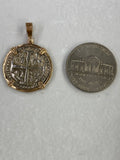 Size comparison: Atocha silver 1 real coin replica pendant beside a U.S. nickel for size comparison