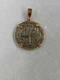 Front: Front view of nickel-sized Atocha silver 1 real coin replica pendant in a genuine 14K gold frame