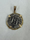 Reverse view of Atocha shipwreck silver two reales coin pendant with 14K gold frame and bail