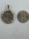 Front view of Atocha silver two reales coin replica pendant in a genuine 14K gold frame
