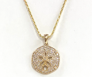 14kt real gold sand dollar covered in diamonds